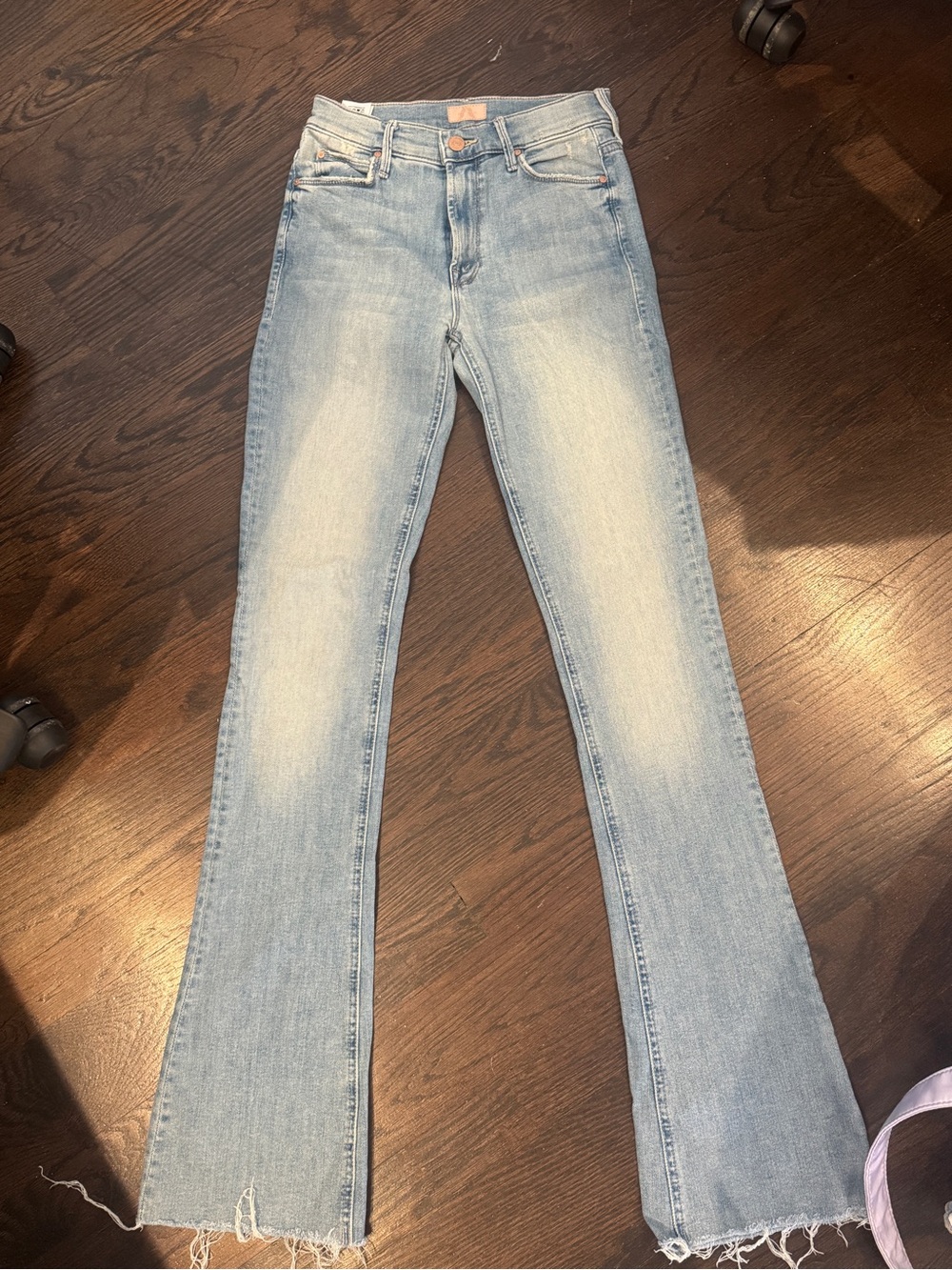 MOTHER Light Wash Flare Jeans in Pale Blue